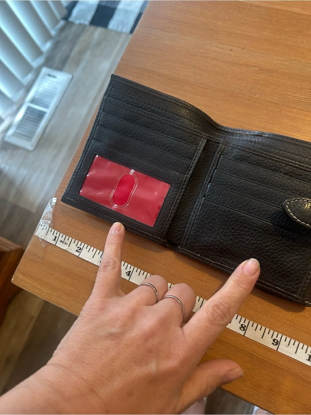 Dooney & Bourke Black Leather Fold Wallet with Logo Plaque